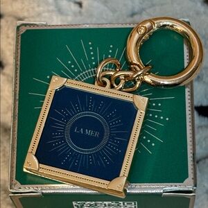 NWOT LA MER dark blue gold tone key chain/charm